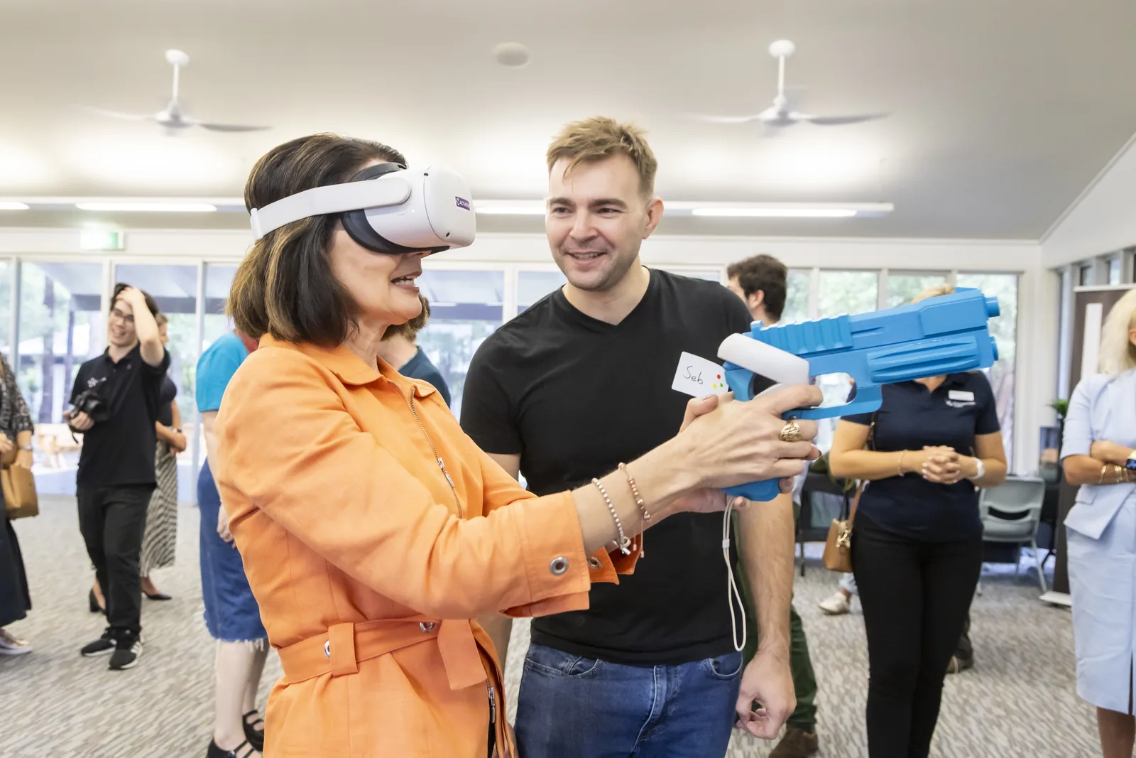 Seb speaking with an attendee during a virtual reality demonstration.