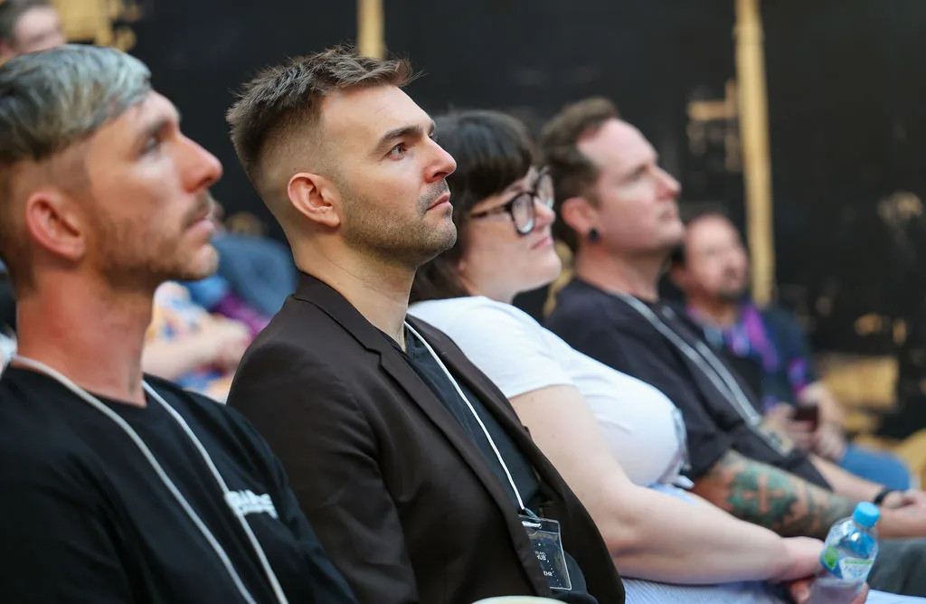 Profile view of Seb watching a presentation at XR Hub.